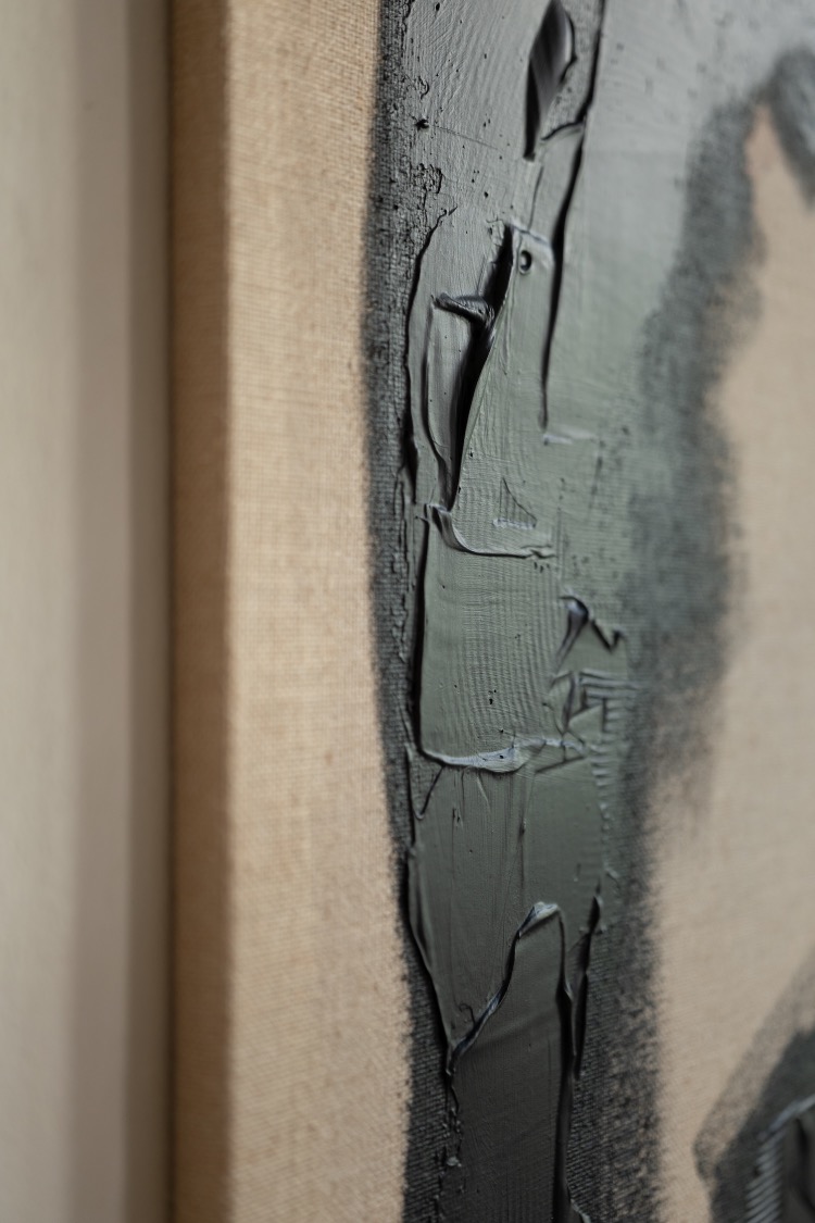 Detail of the textured acrylic painting with black abstract motif on jute canvas in the section